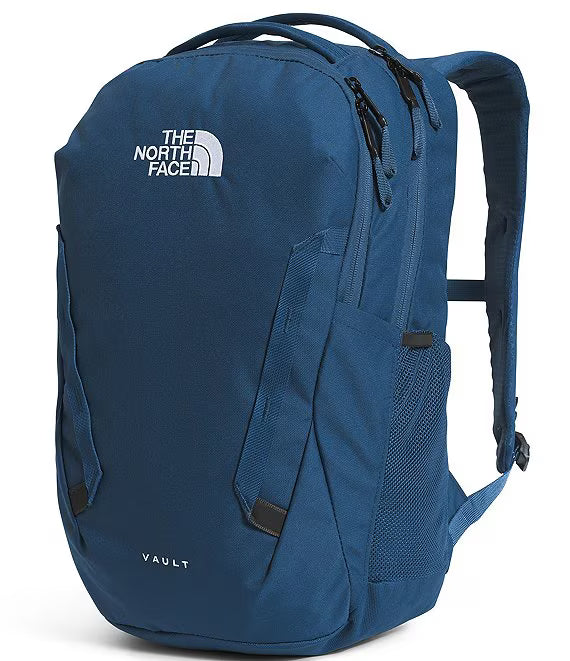 A blue The North Face Vault backpack shown from a three-quarter front view on a white background.