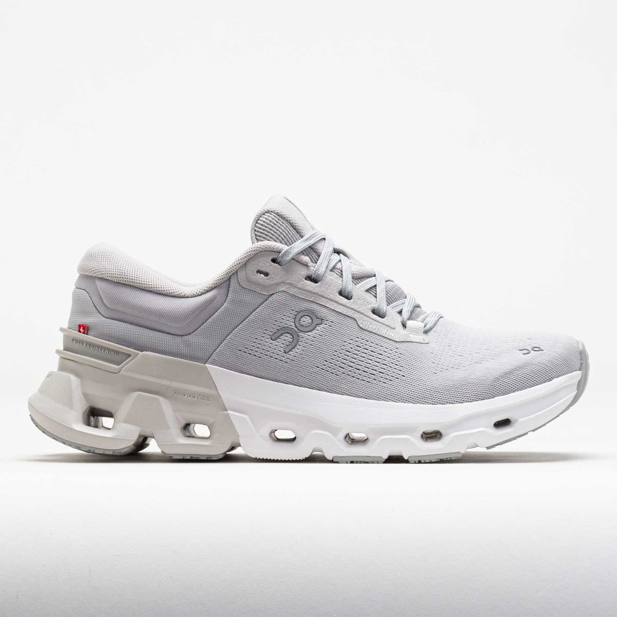 Gray athletic shoe with a white sole on a light gray background