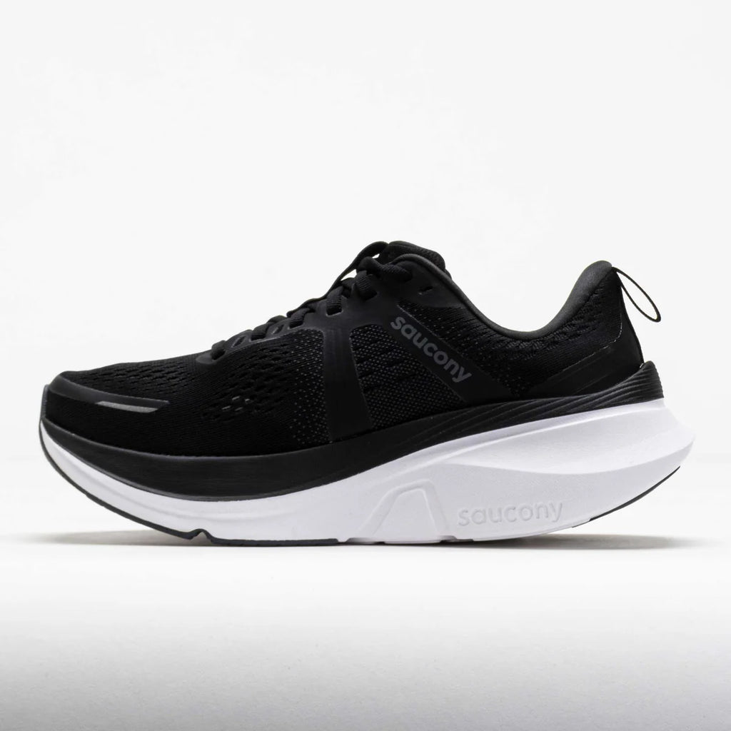 A black Saucony running shoe with a thick white midsole, shown in a side profile view against a light gray background.