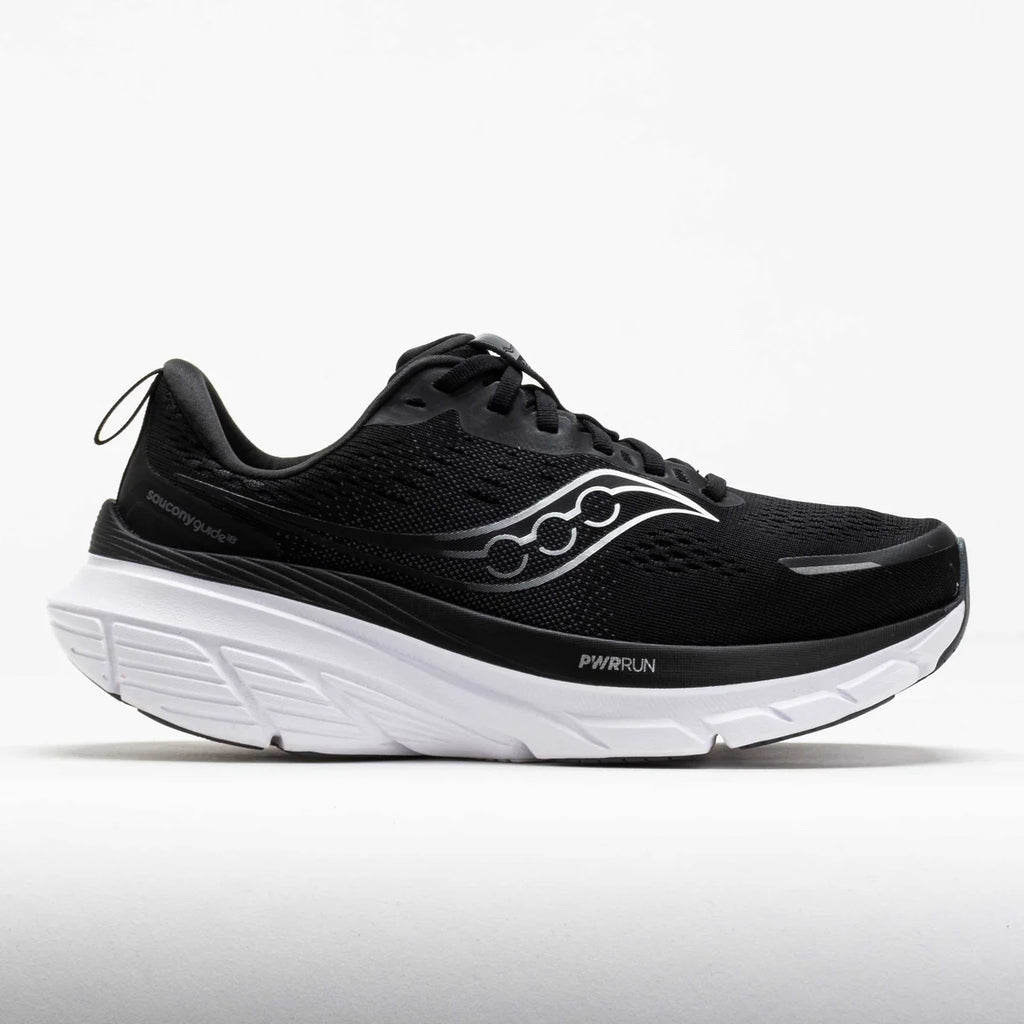 Black running shoe with white sole on a light gray background
