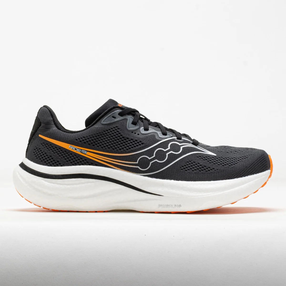 A Saucony running shoe in black mesh with a white midsole and orange accents, shown in a side profile on a light gray background.