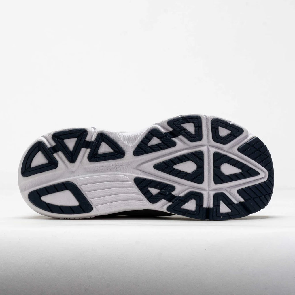 Close-up of a running shoe sole with a white and black design on a light gray background