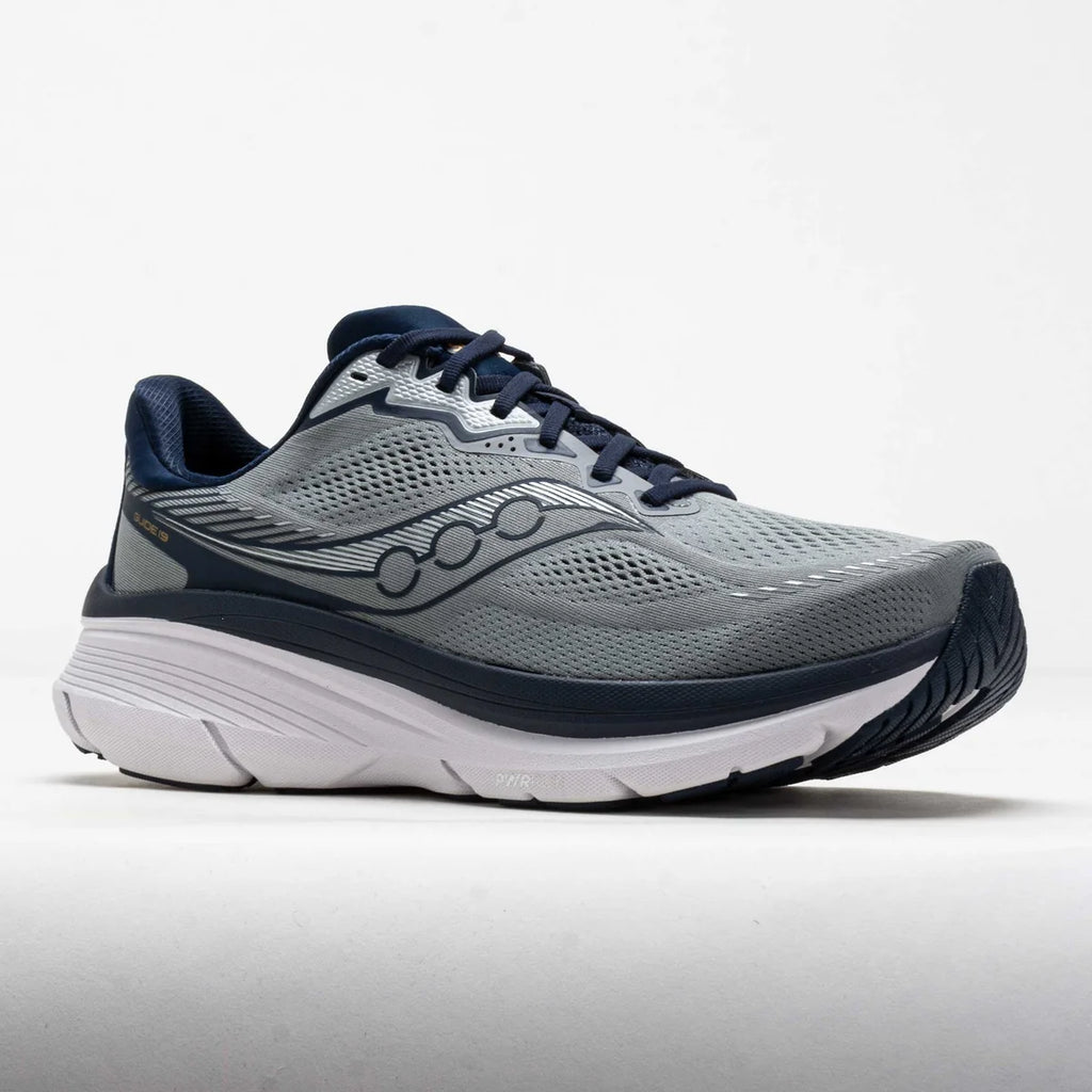 Gray and navy running shoe on a light gray background
