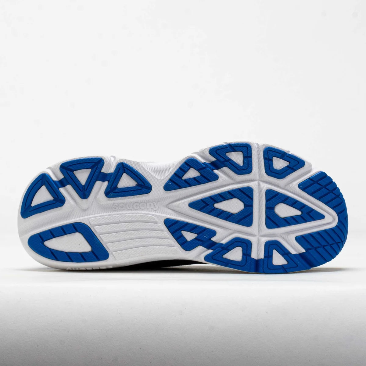 White and blue athletic shoe sole on a light gray background