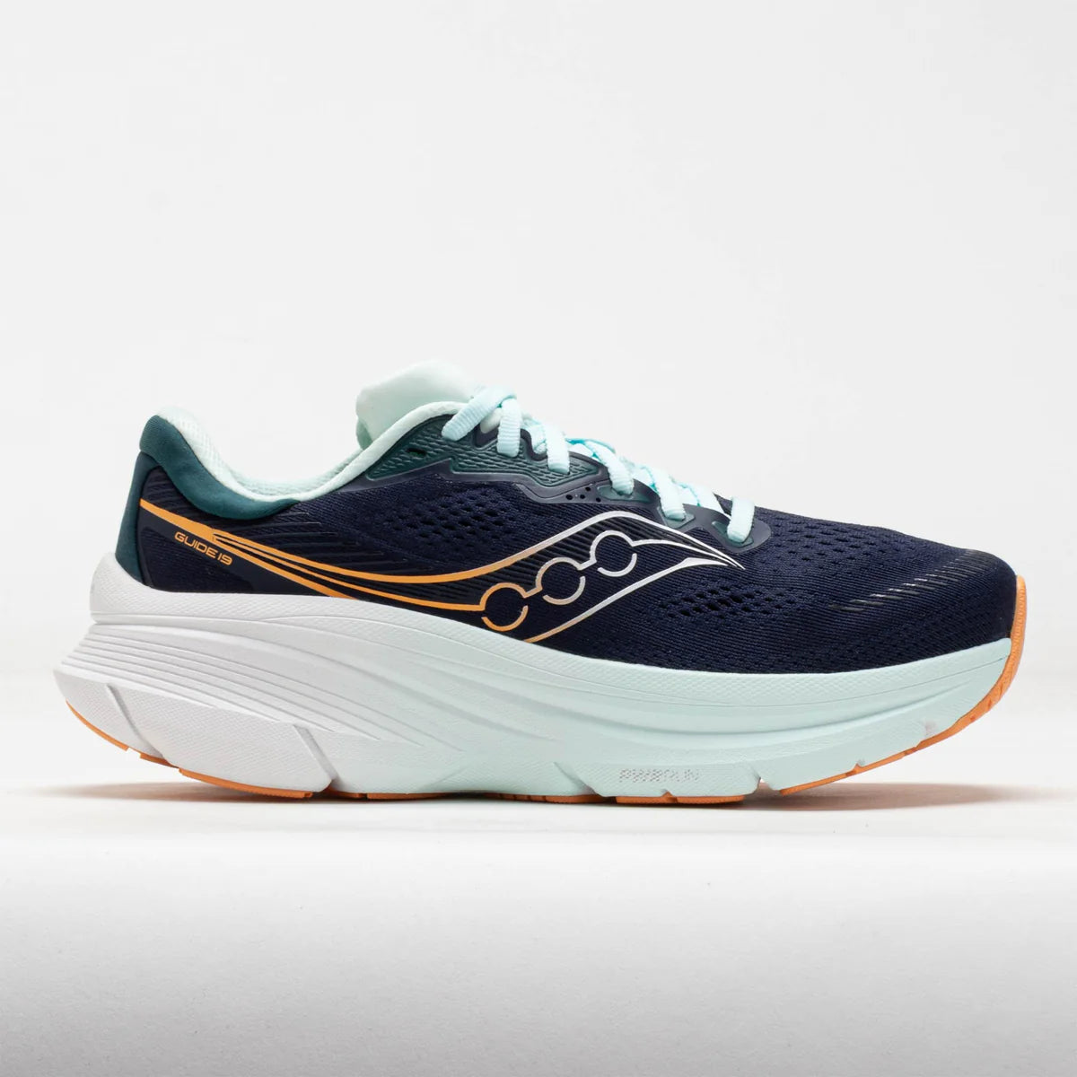 Navy running shoe with white sole on a light gray background