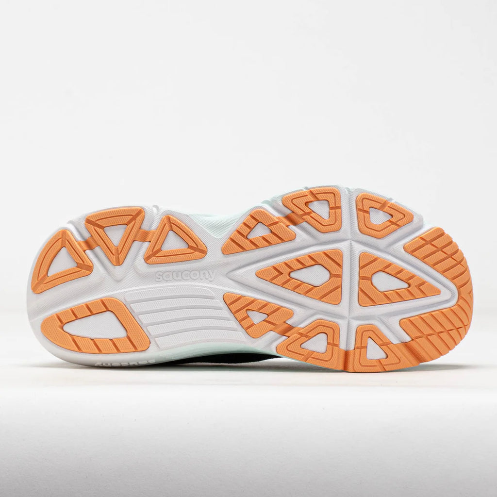 Close-up of a shoe with orange and white sole design on a light gray background