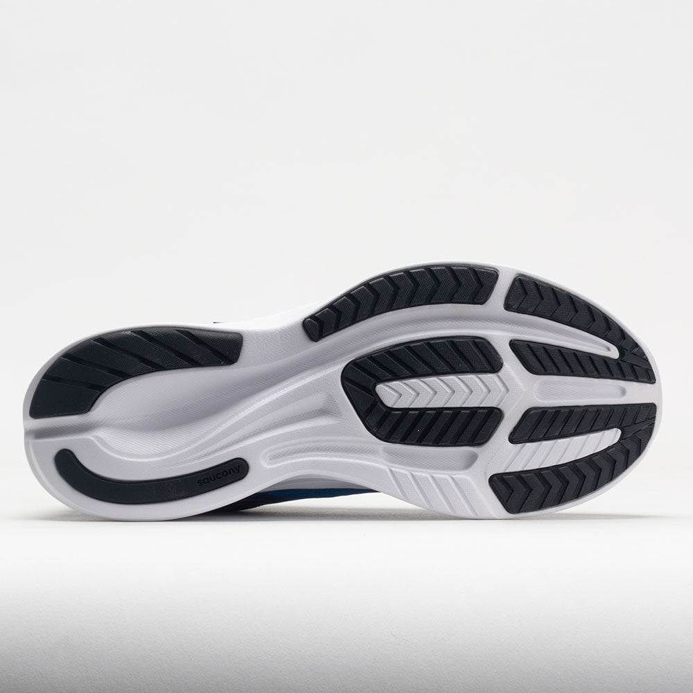 White running shoe with black sole on a light gray background