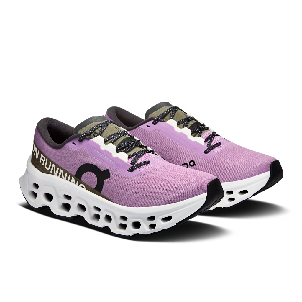 Purple running shoes with white sole on a white background