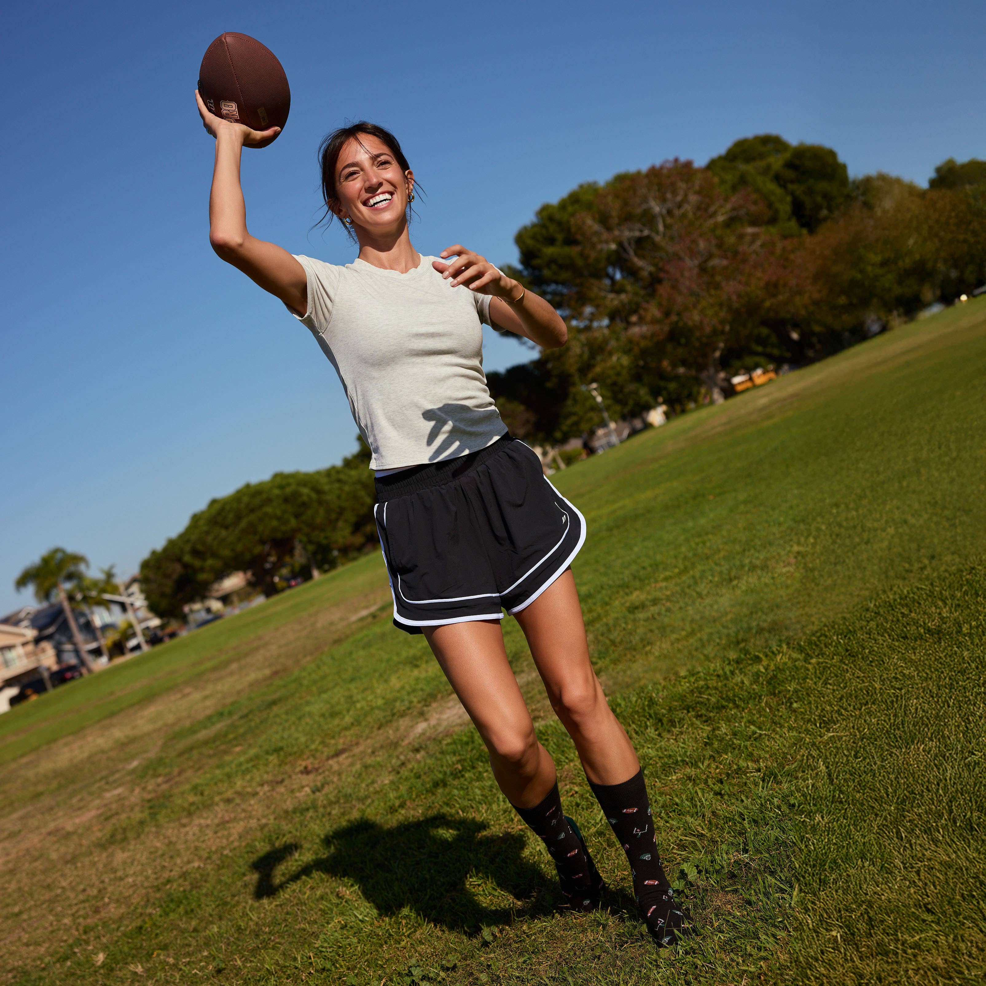 Socks that Support Youth Sports (Black Footballs)