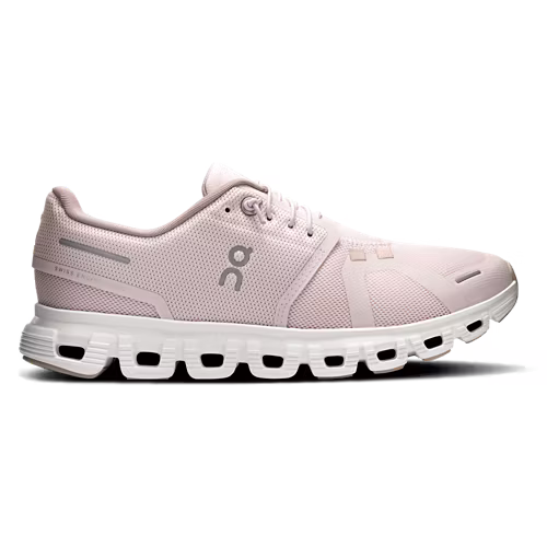 Pink running shoe with white sole on a white background