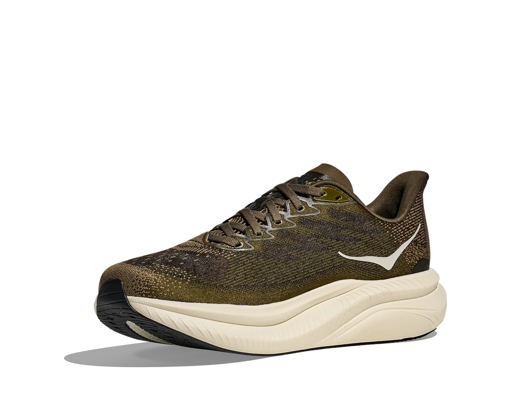 A single athletic running shoe shown in a side profile on a clean white background. The upper is a textured olive green and brown knit, with a thick cream-colored midsole and a small white logo on the side.