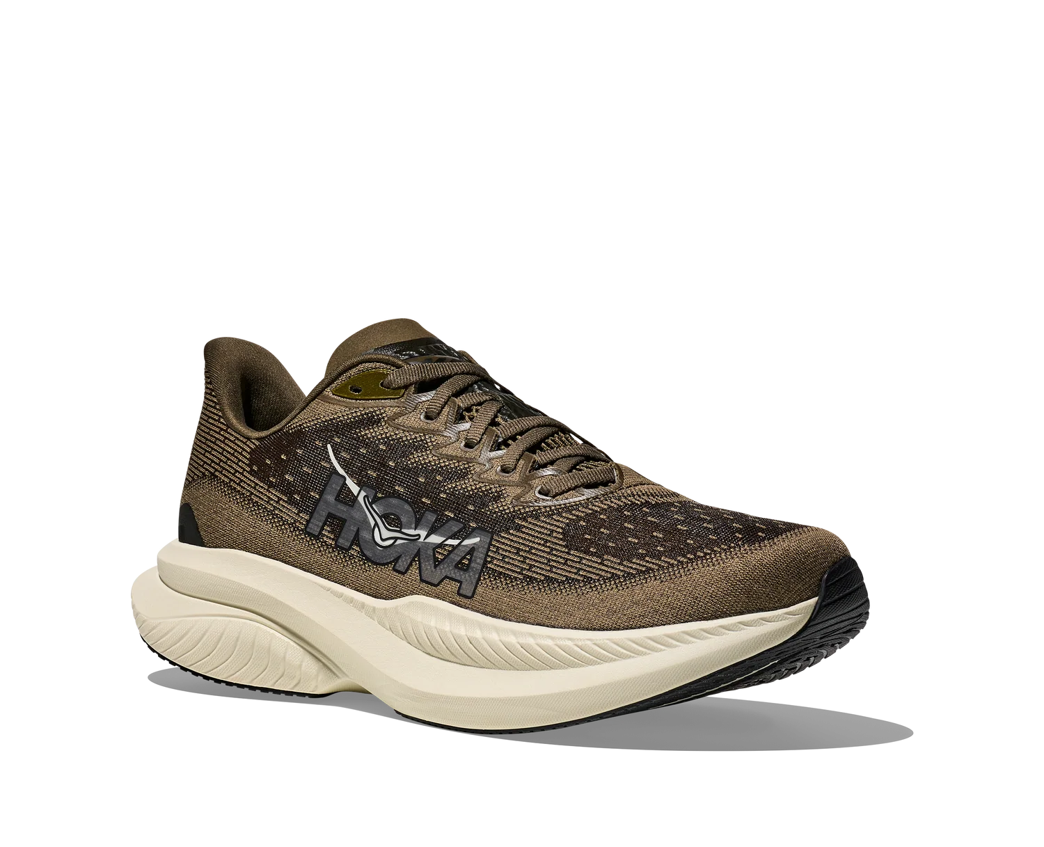 A Hoka running shoe in brown and beige with a thick cream-colored midsole, shown from a side profile on a white background.