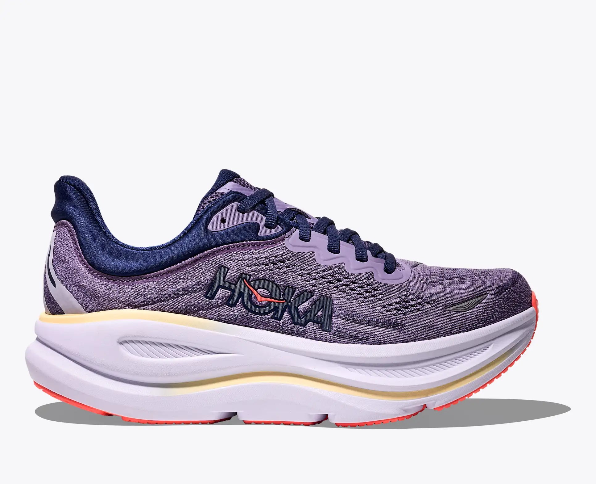 Purple running shoe with white sole on a white background