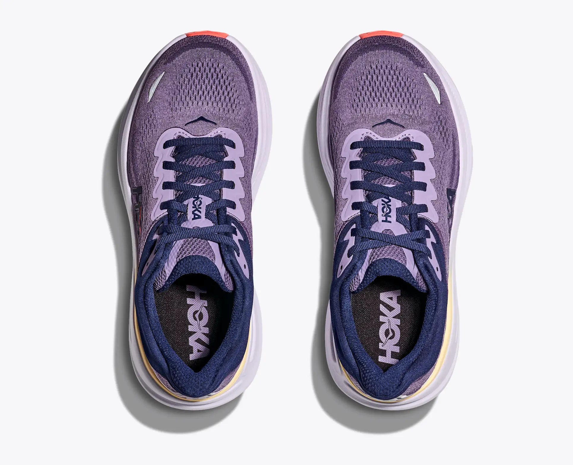 Pair of Hoka running shoes on a white background