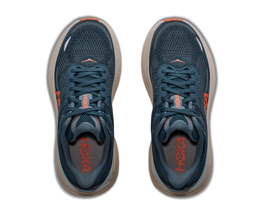 Pair of blue running shoes with orange accents on a white background