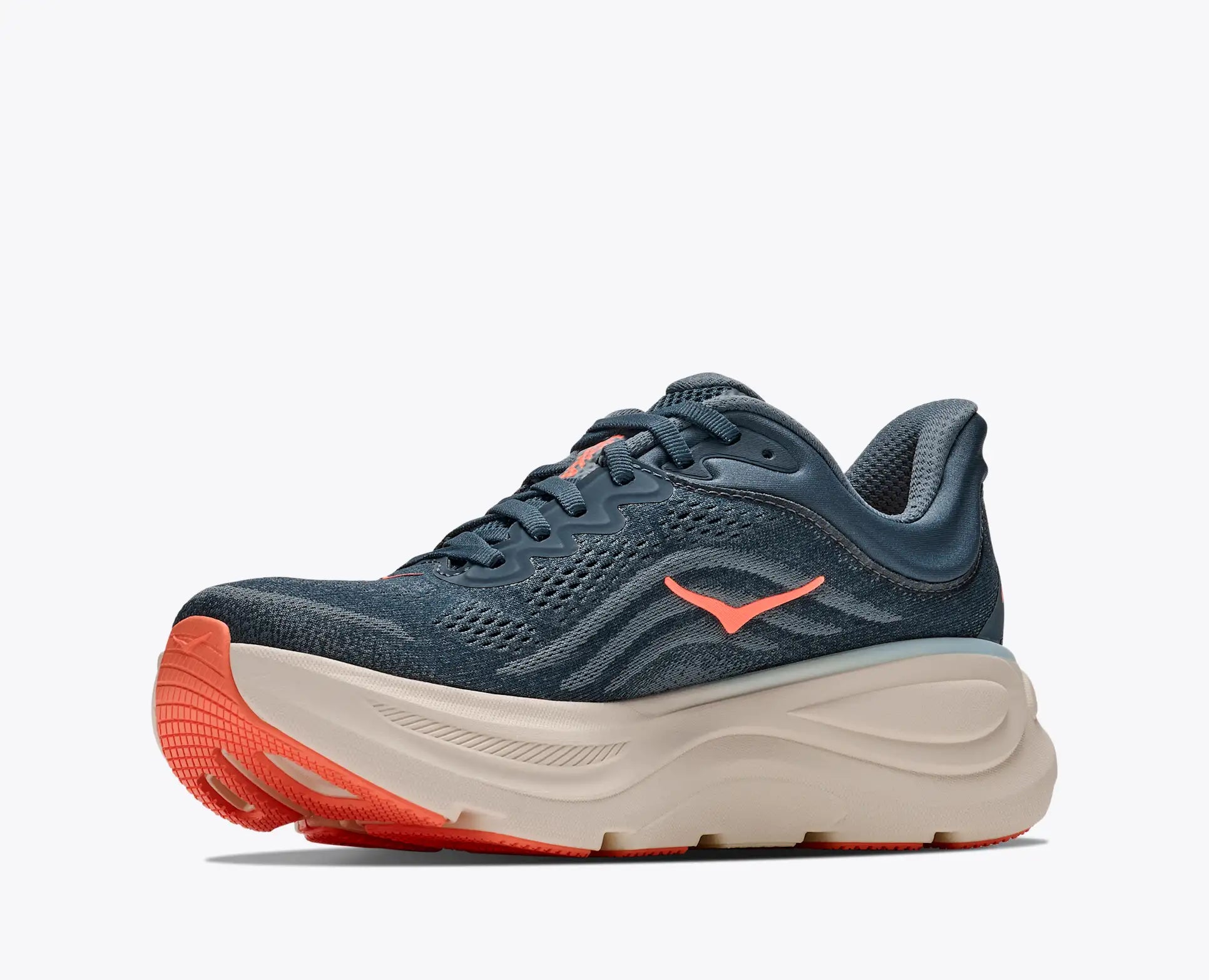 A single athletic running shoe shown in profile against a light gray background. The upper is a dark slate blue-gray mesh, with a prominent bright coral-orange logo on the side, a thick cream-colored midsole, and a matching coral-orange outsole.