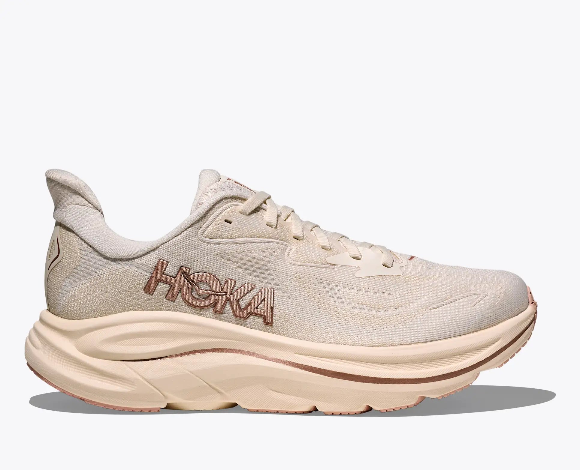 Beige running shoe with 'Hoka' branding on a white background