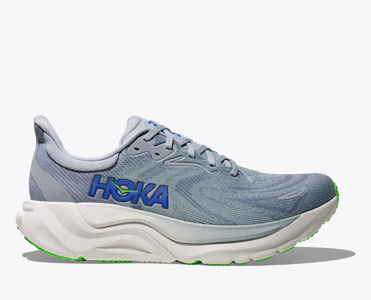 Gray running shoe with blue Hoka branding on a white background