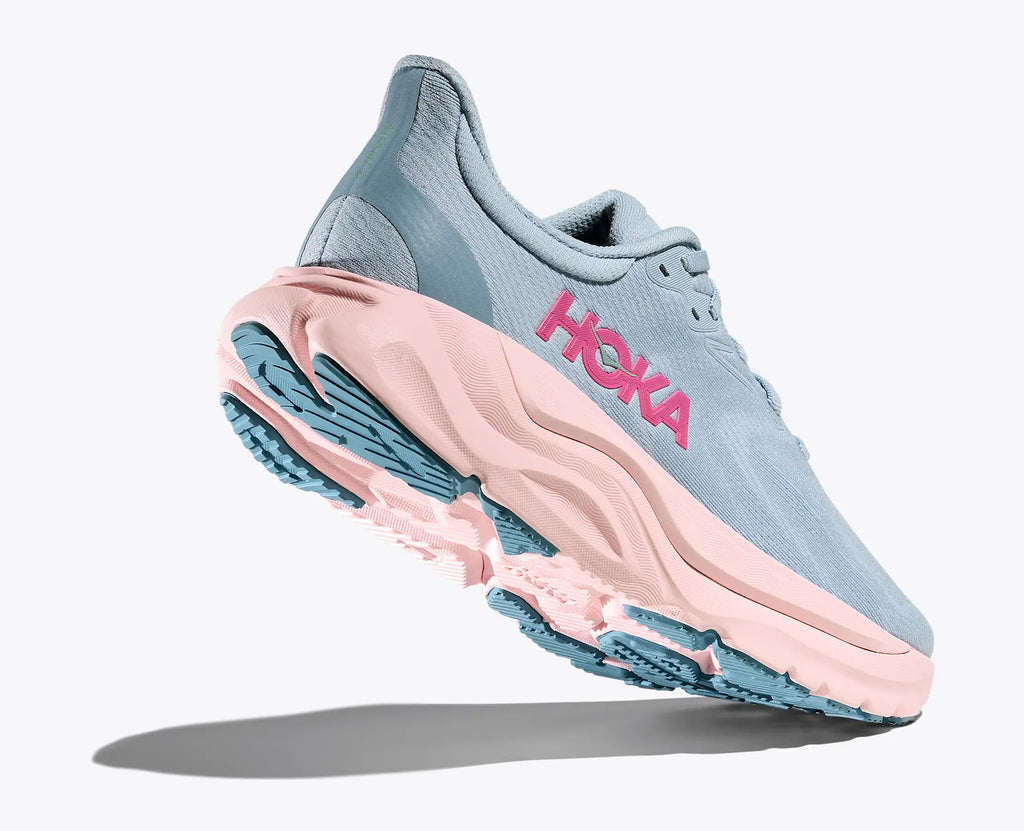 Hoka running shoe with pink and blue design on a white background