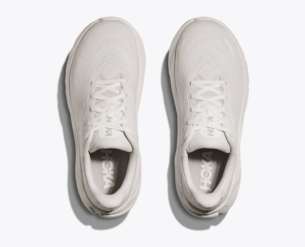 Pair of white sneakers on a light gray background
