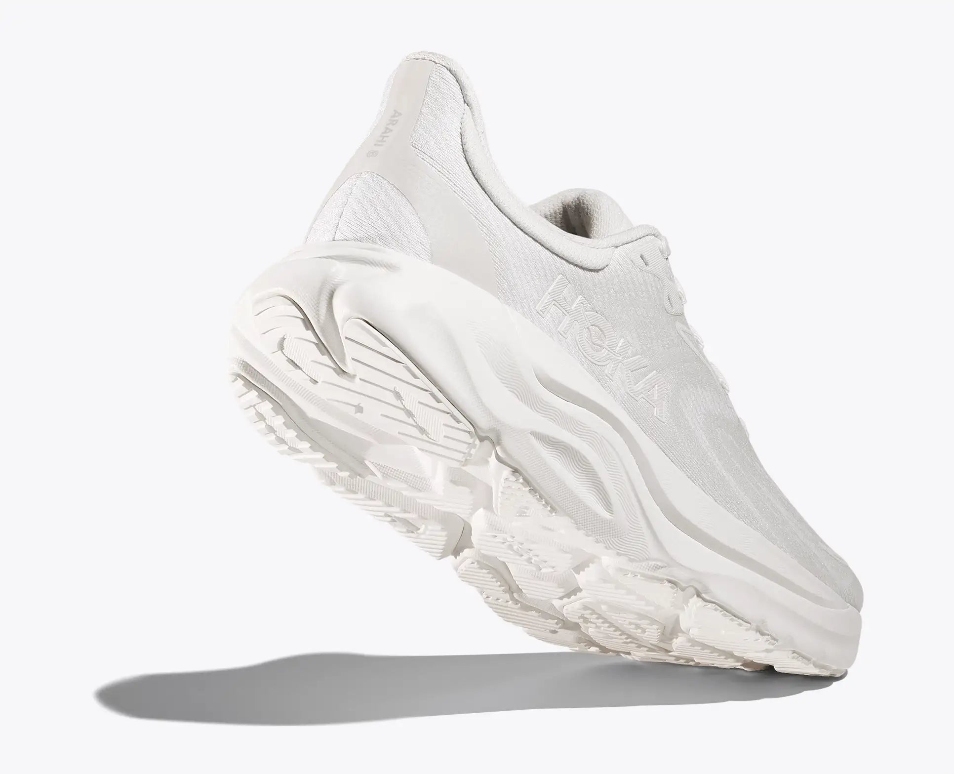 White athletic shoe on a light gray background