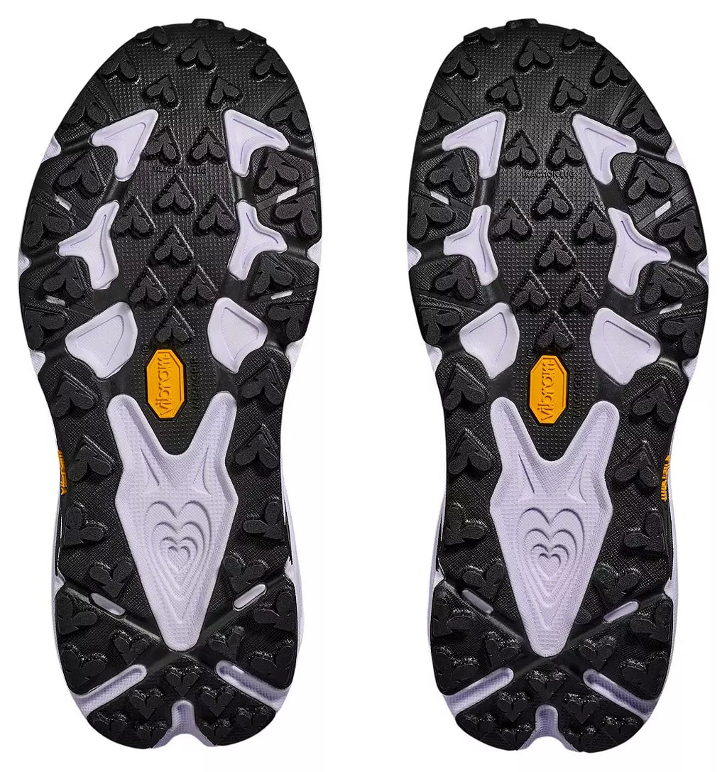 Close-up of the sole of a black hiking shoe with a brand logo on a white background