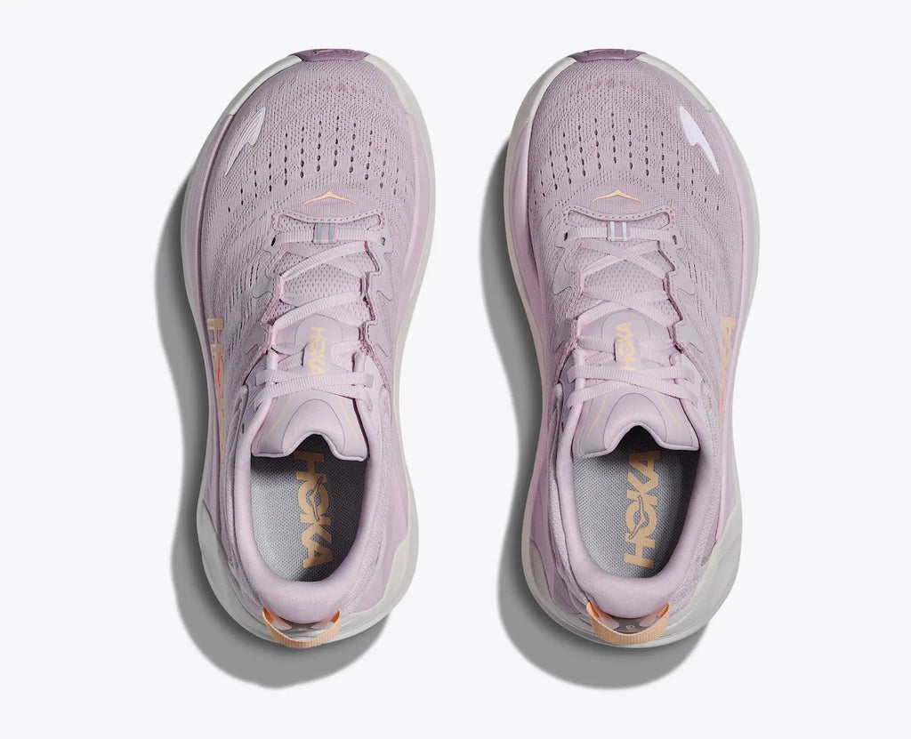 Pair of pink running shoes on a white background