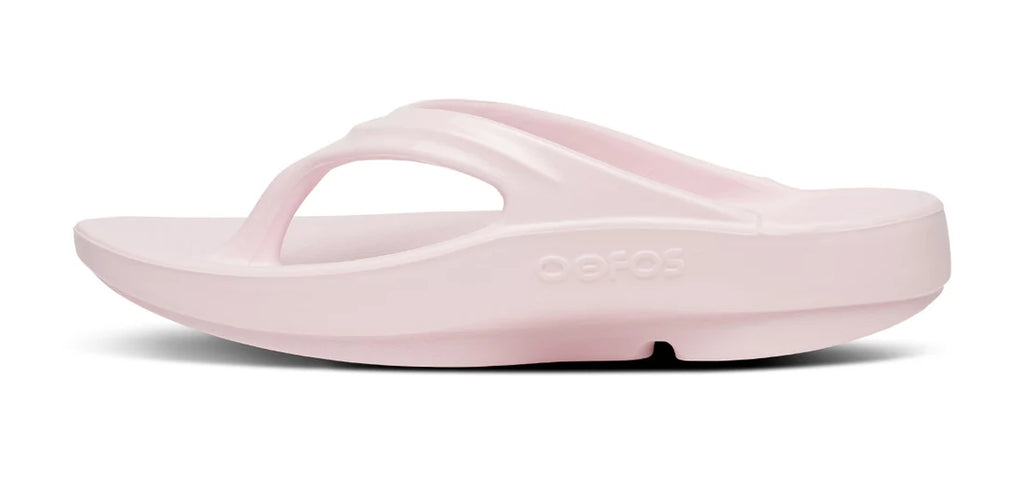 A light pink FitFlop flip-flop sandal shown from a side profile view against a white background.