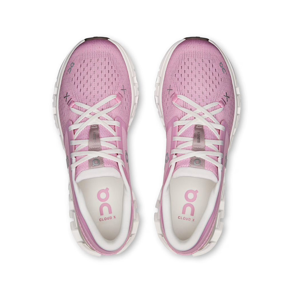 Pink running shoes with white laces on a transparent background