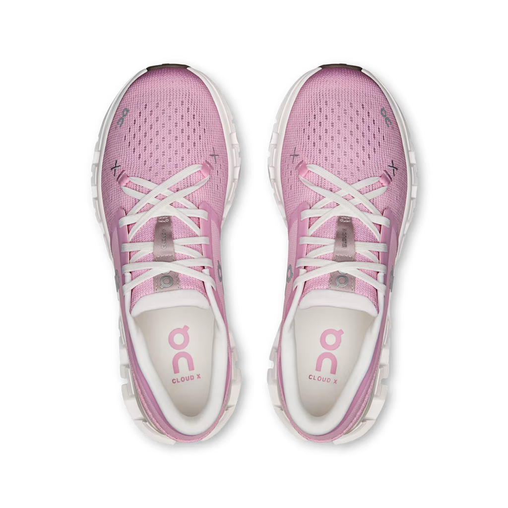 Pink running shoes with white laces on a transparent background