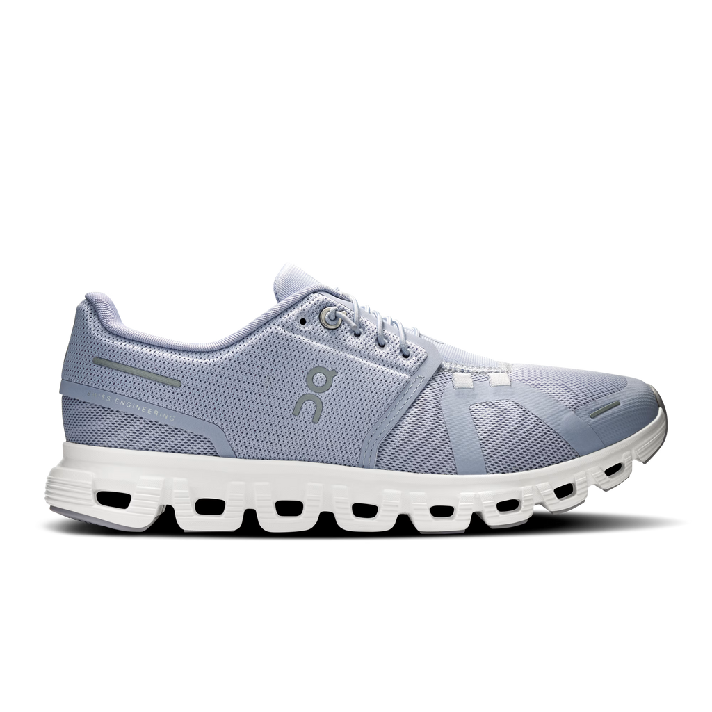 Gray running shoe with white sole on a white background