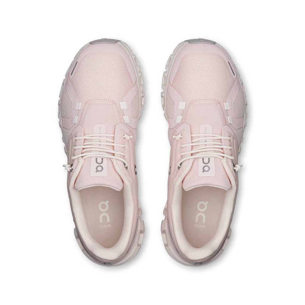 Pair of pink athletic shoes on a transparent background
