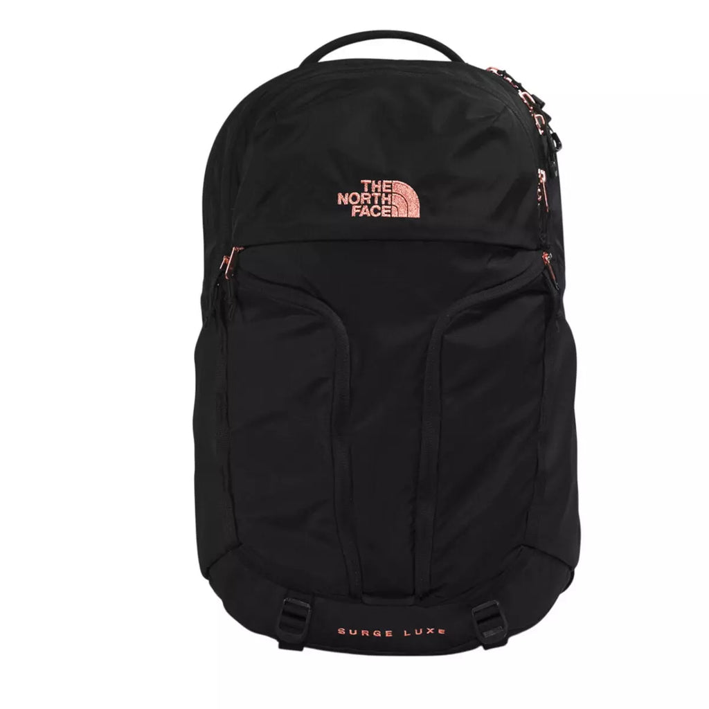 The North Face Surge Luxe backpack in black with rose gold logo and zipper accents, shown against a plain white background.