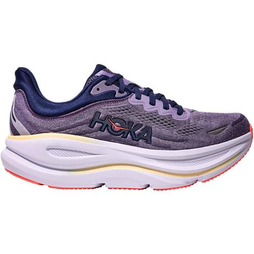 Purple running shoe with white sole on a white background
