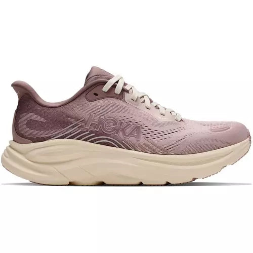 Pink running shoe with white sole on a white background