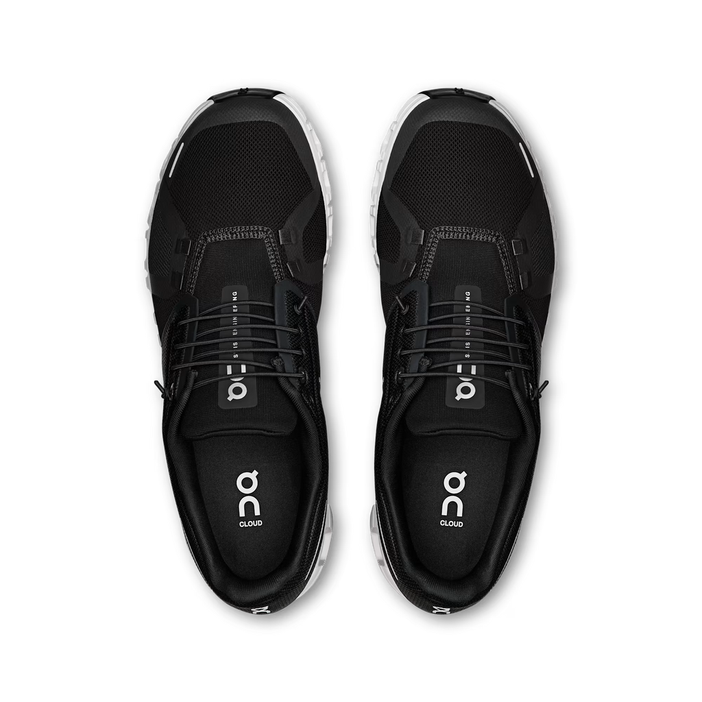 Black running shoes with 'on' branding on a transparent background