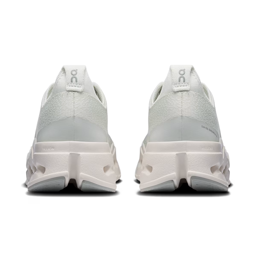 White athletic shoes with a brand logo on a transparent background