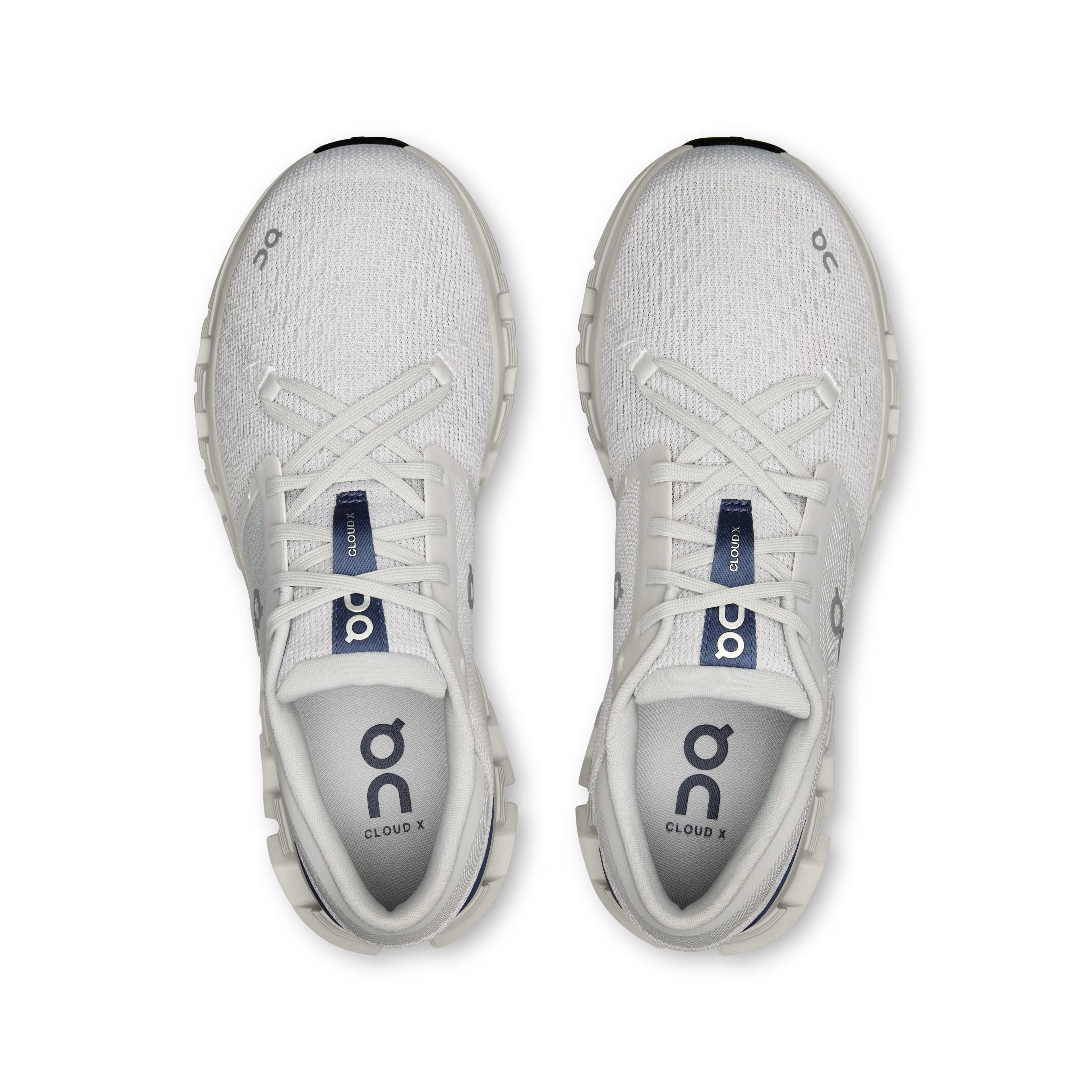 White athletic shoes with 'DC' branding on a white background