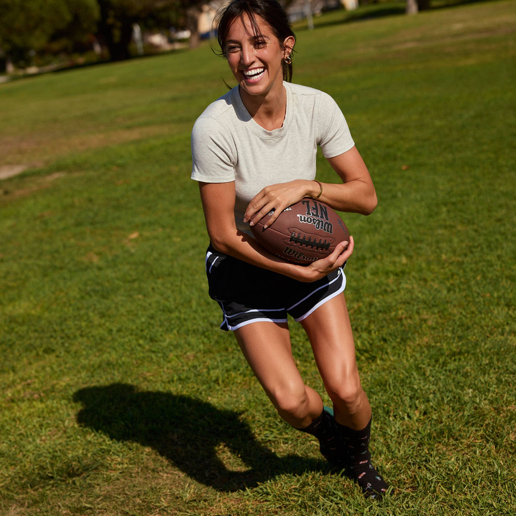 Socks that Support Youth Sports (Black Footballs)