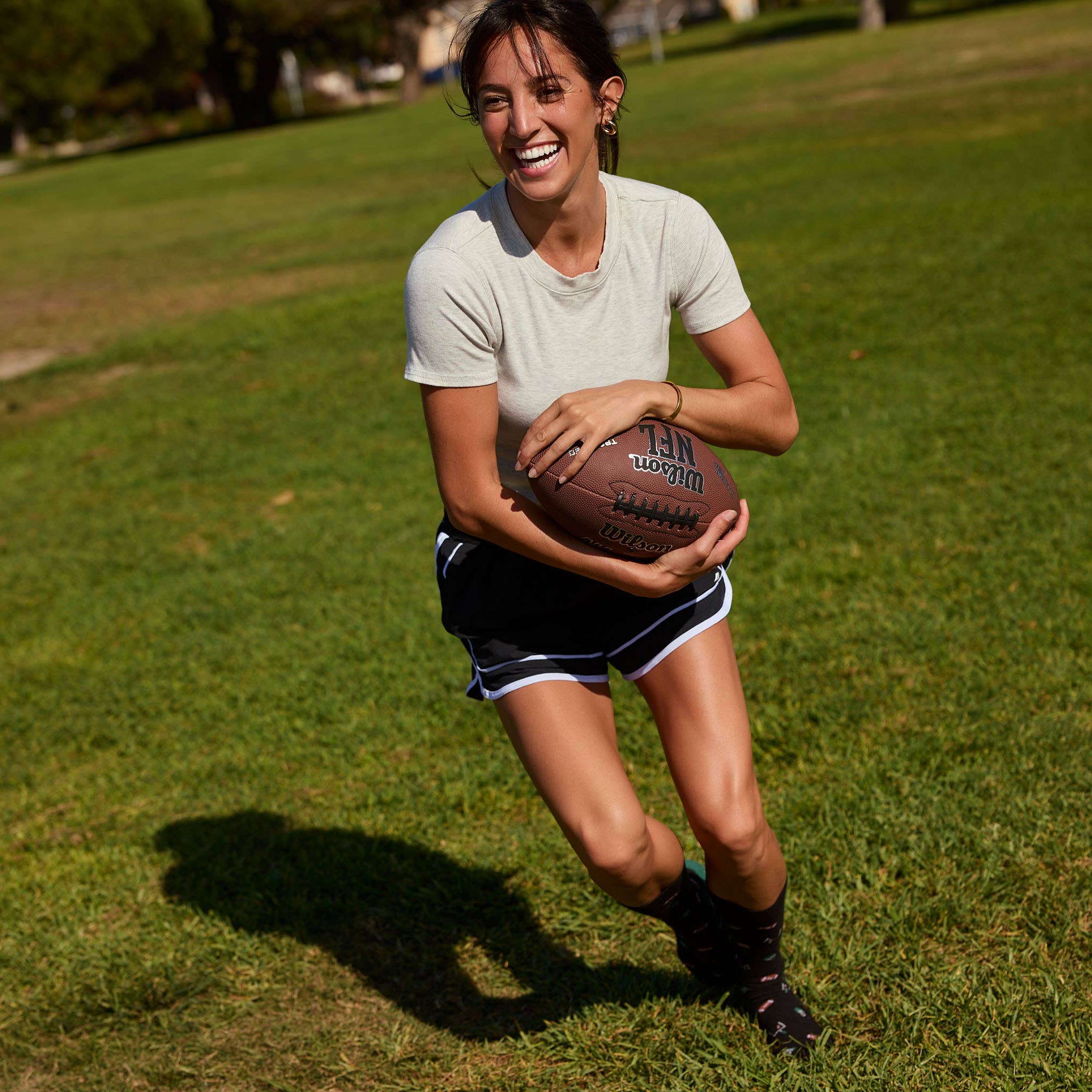 Socks that Support Youth Sports (Black Footballs)