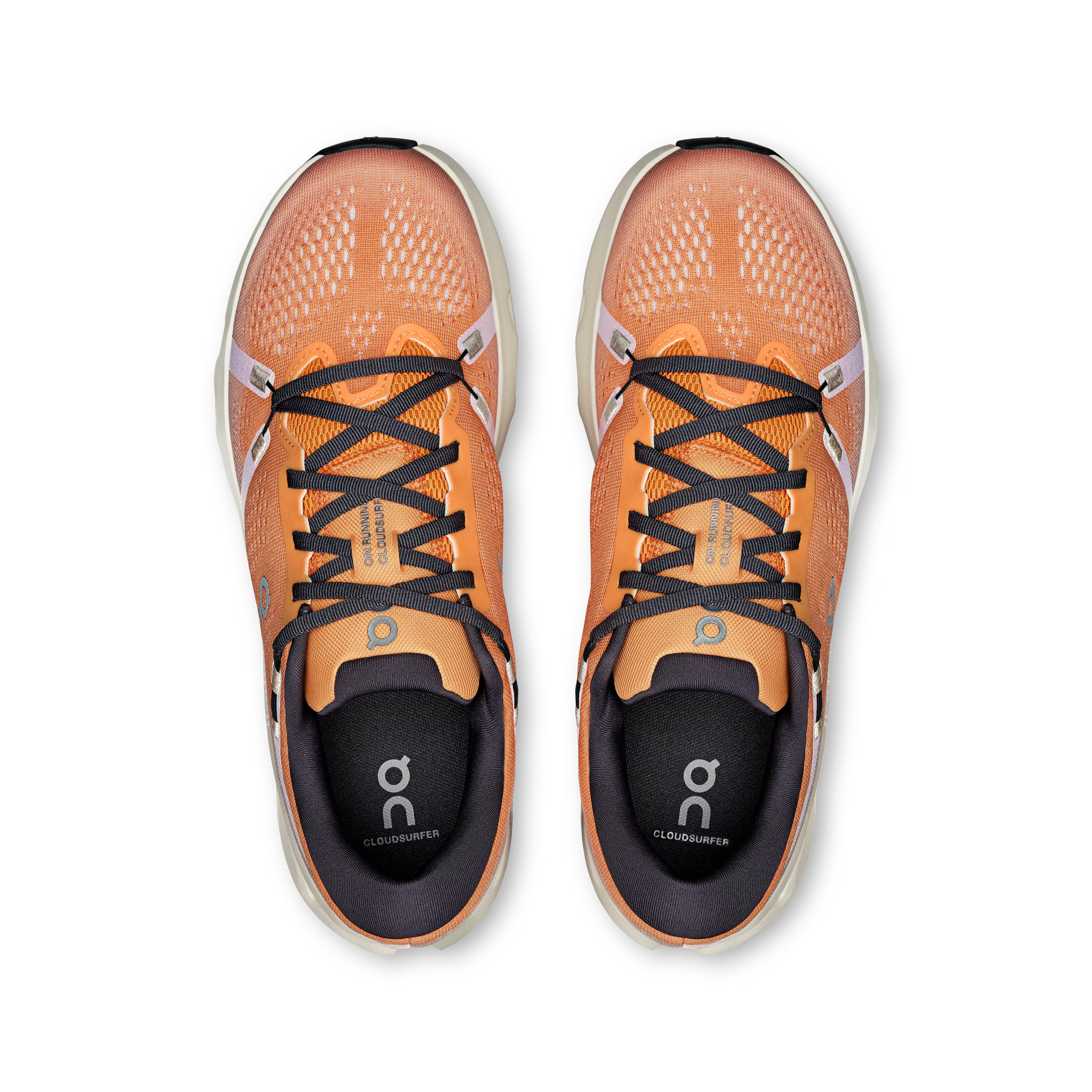Pair of orange running shoes with black laces on a white background