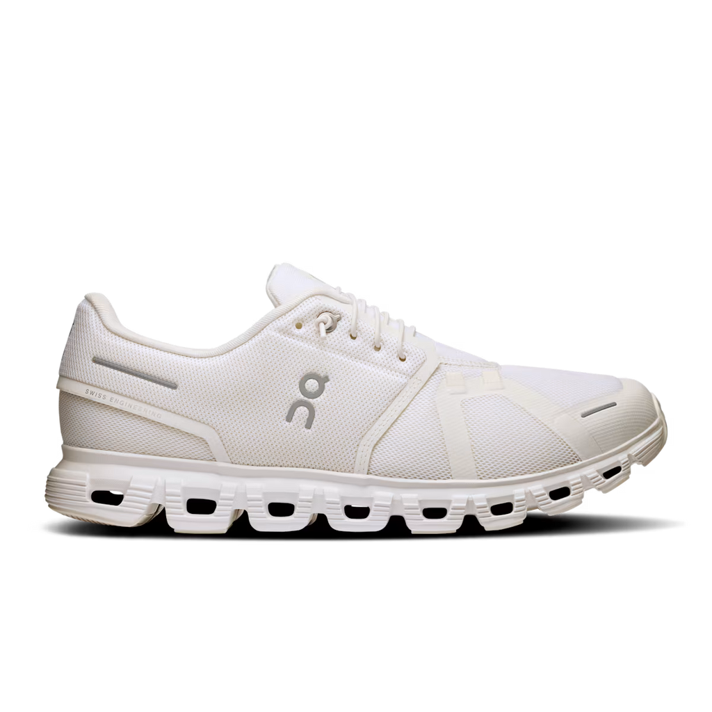 White sneaker with a logo on a black background