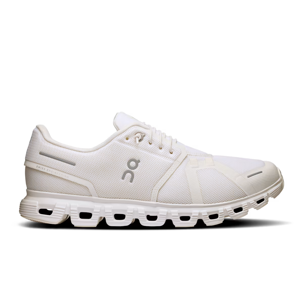 White sneaker with a logo on a black background