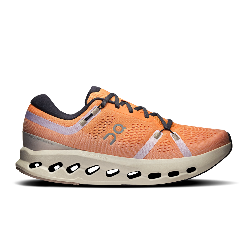 Orange running shoe with a white sole on a transparent background