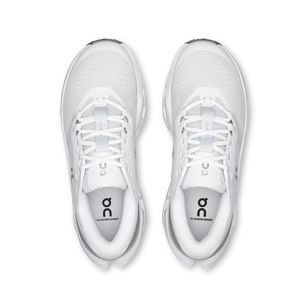White running shoes with a brand logo on a transparent background