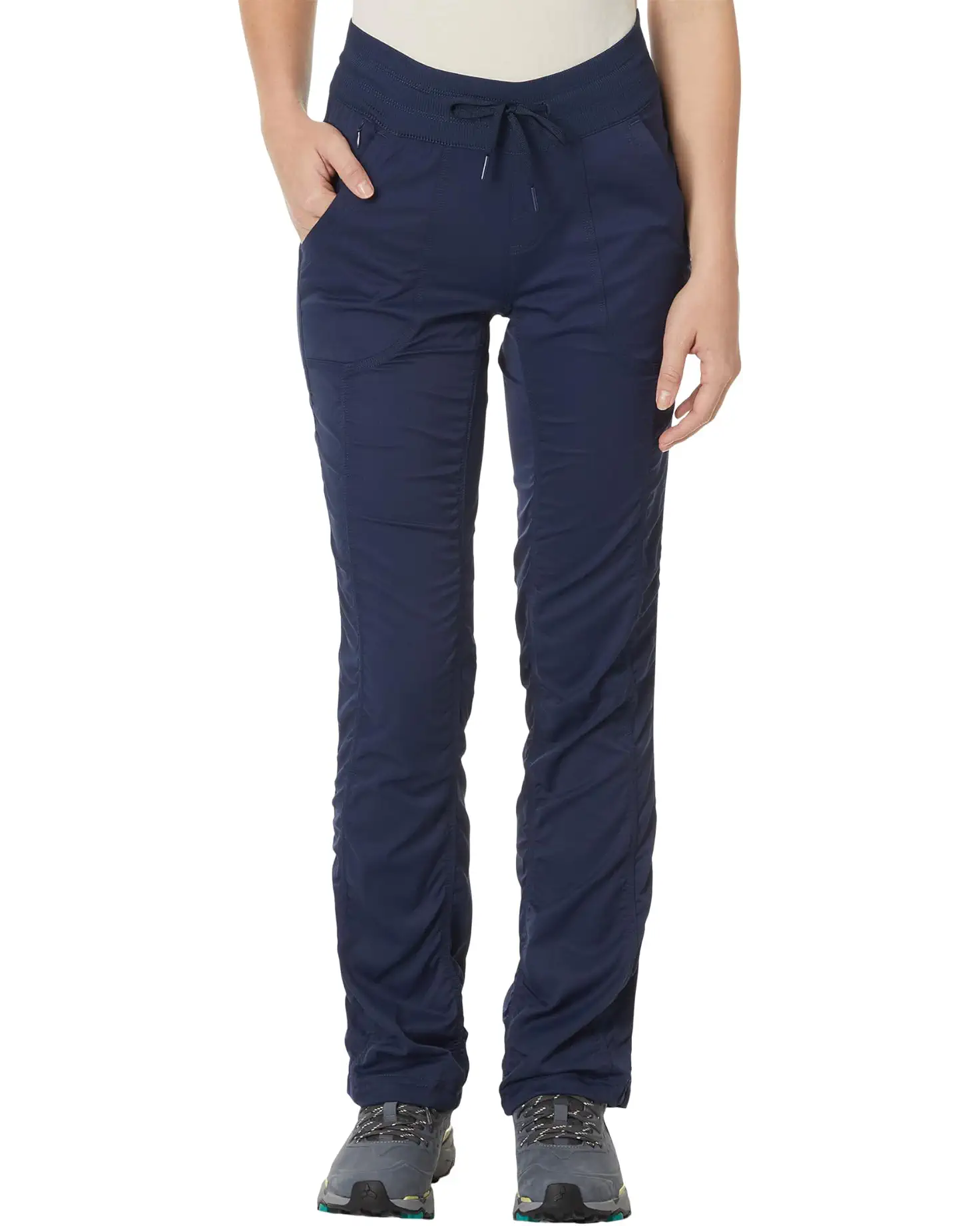 Navy blue pants worn by a person on a white background