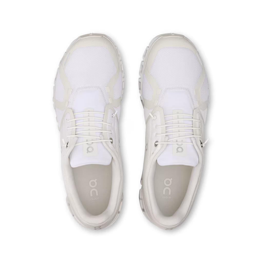 Pair of white sneakers with 'on' branding on a white background