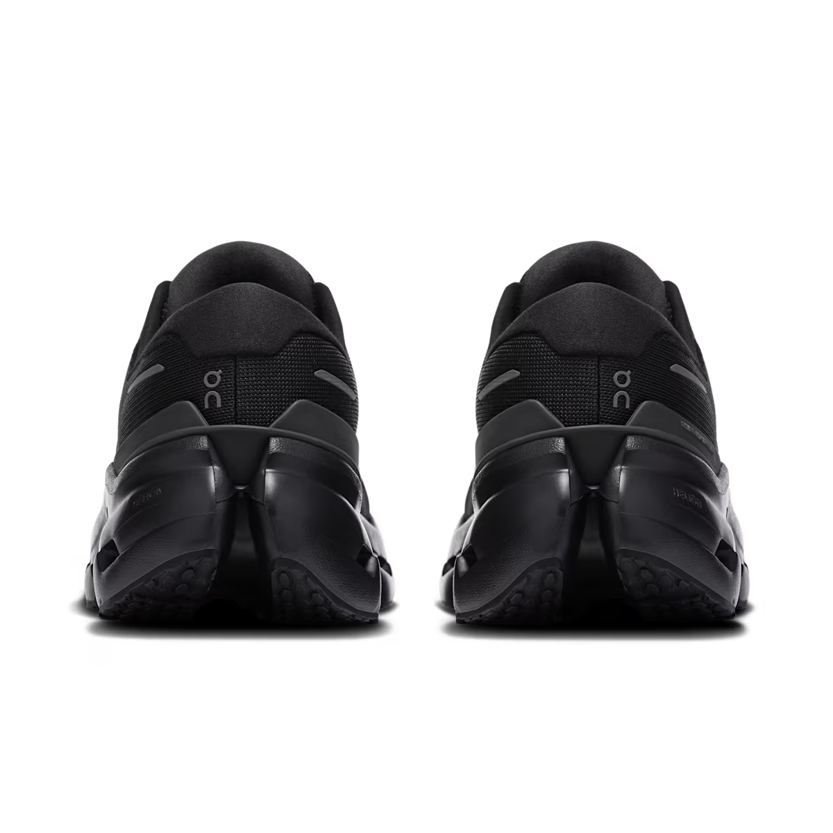 Black athletic shoes with 'oc' branding on a white background