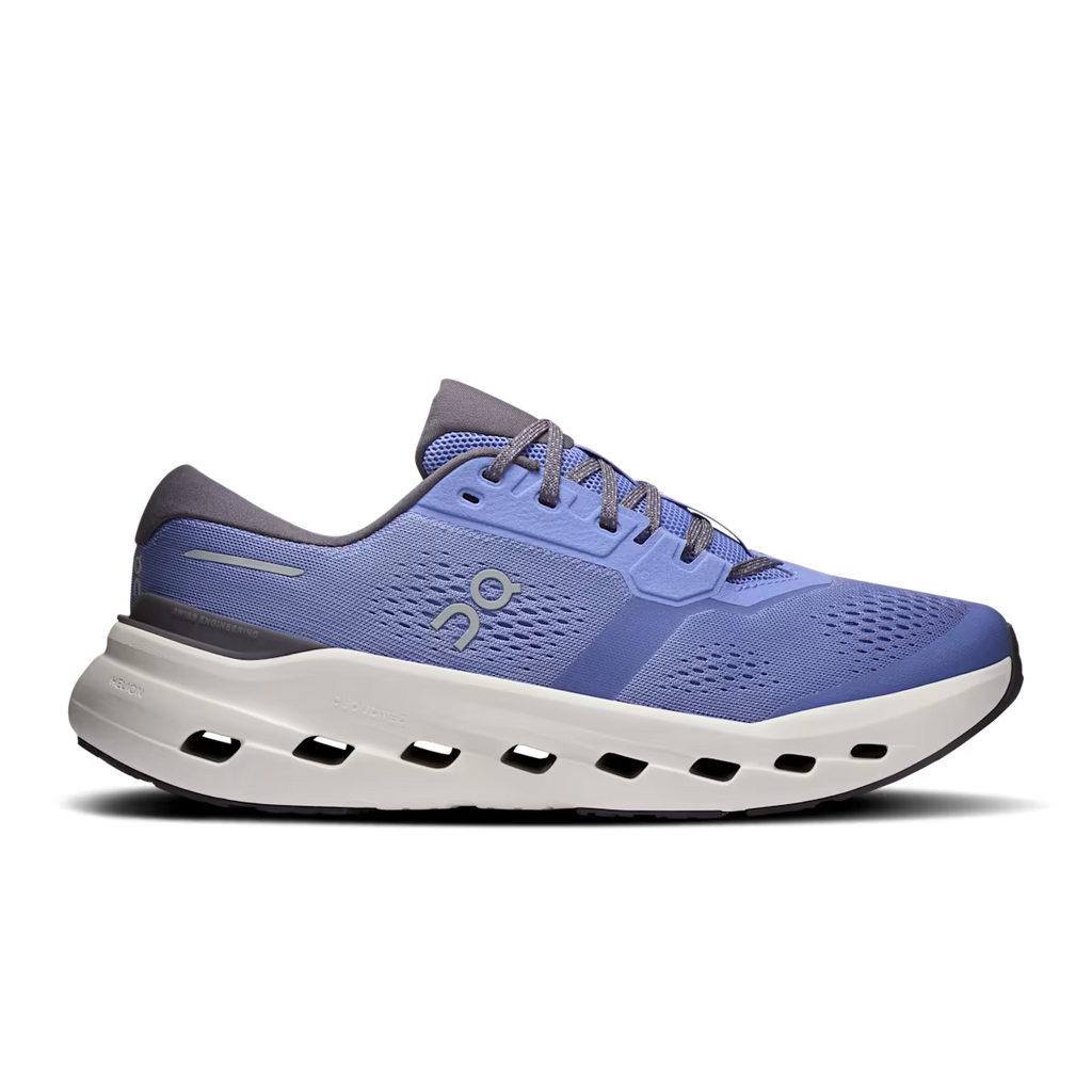 Blue running shoe with white sole on a white background