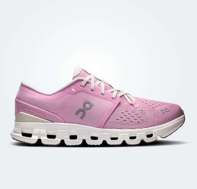 Pink running shoe with white sole on a light gray background